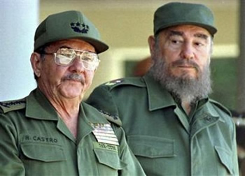 Cuba's President Fidel Castro (R) stands with his brother Raul during an event in Havana in this June 28, 2001